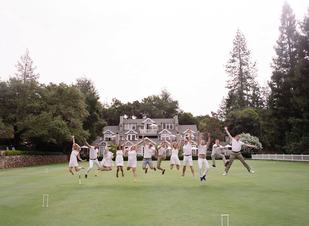 jump wedding photo with wedding party